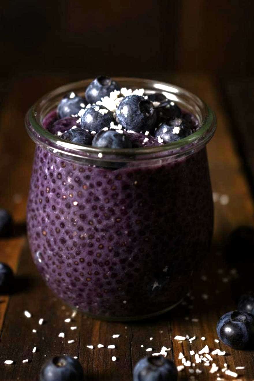 chia pudding ingredients with blueberries and milk